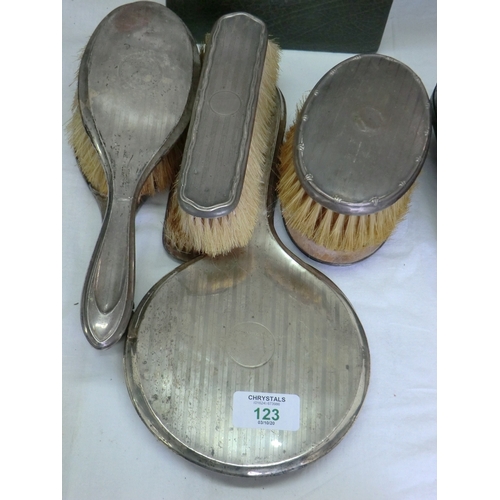 123 - Six silver backed hairbrushes plus two silver backed hand mirrors