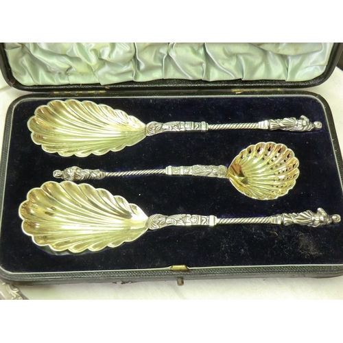 126 - A cased set of fancy EPNS apostle serving spoons