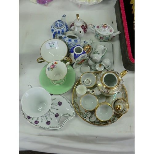 136 - A collection of miniature tea sets