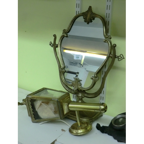 256 - Brass dressing table mirror and a wall light