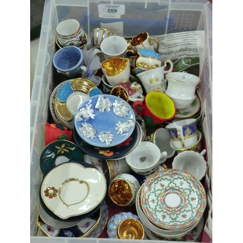 288 - Collection of miniature cups and saucers and tea sets, etc.