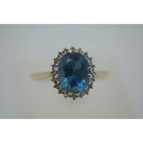 318 - 9 ct gold blue topaz and diamond ring, size P