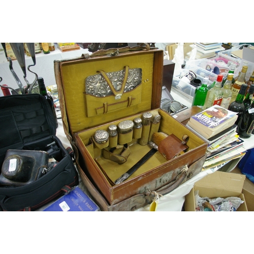 360 - A leather toilet case having silver topped hairbrushes, bottles and tray within