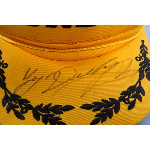 118 - A Dunlop winner's cap signed Joey Dunlop to peak