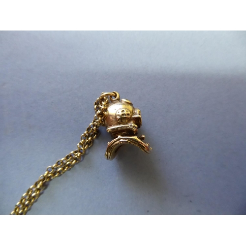 105 - 9ct gold diver's helmet pendant on a 9ct gold chain - total wt. 14.5g