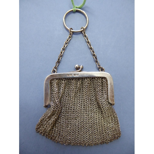 123 - A small silver chain mail sovereign purse