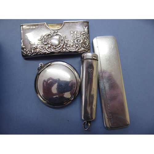 127 - A silver case for a cigar holder, silver card case, snuff box and comb