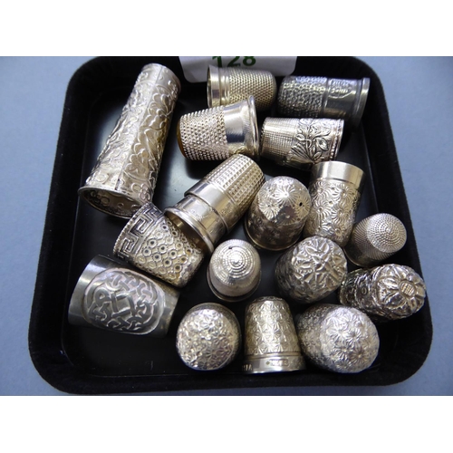 128 - Thirteen silver thimbles plus others