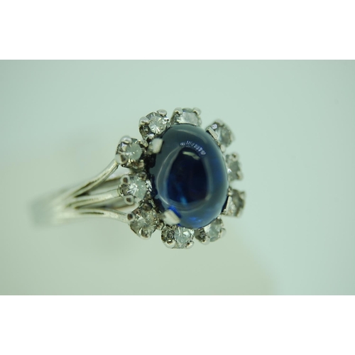 249 - Unusual French cabochon sapphire and diamond ring set in 18ct white gold with diamond surround