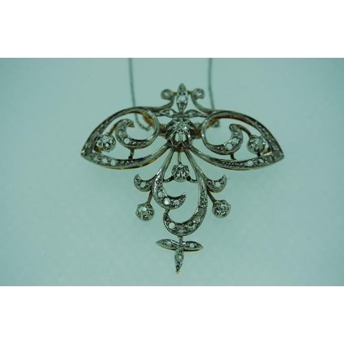 250 - A pretty Art Nouveau diamond pendant set in platinum and 18ct yellow gold suspended from an 18ct whi... 