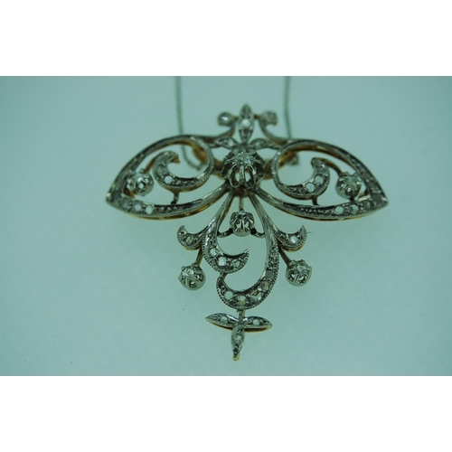 250 - A pretty Art Nouveau diamond pendant set in platinum and 18ct yellow gold suspended from an 18ct whi... 