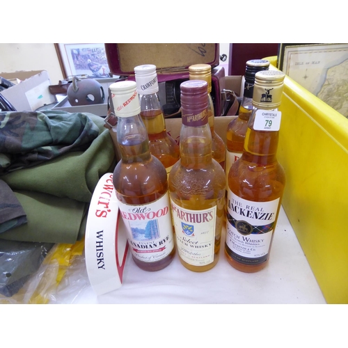 79 - Six bottles of various whiskies together with a Dewer's ashtray