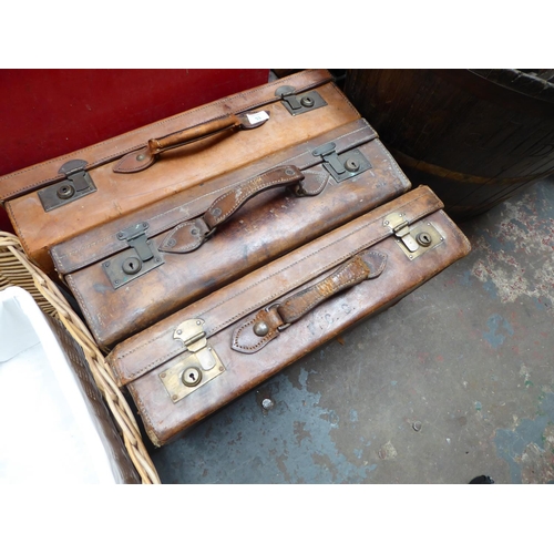 53 - Three leather suitcases NB. This lot is at our Peel Road store. READ THE SALE INFO