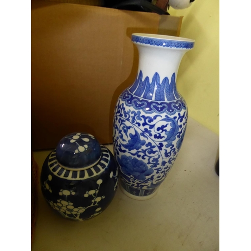 146 - A blue and white oriental Baluster vase together with two ginger jars