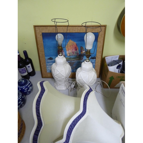 151 - Two lamps with shades together with oil painting of boats signed 