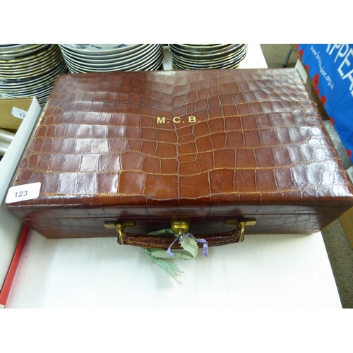 123 - A crocodile skin ladies jewellery case with keys