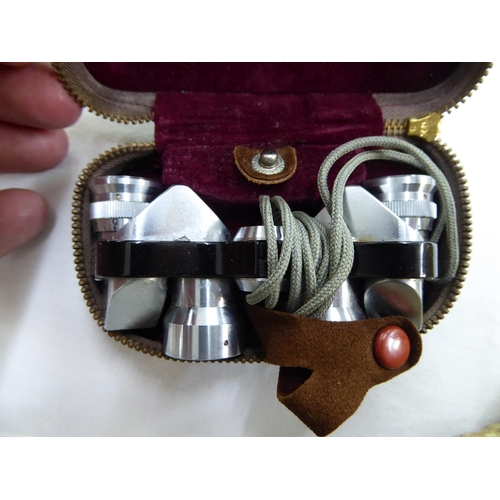 129 - Pair of miniature binoculars (cased)