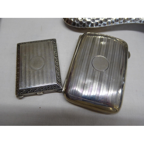 35 - A silver vesta and a silver cigarette case