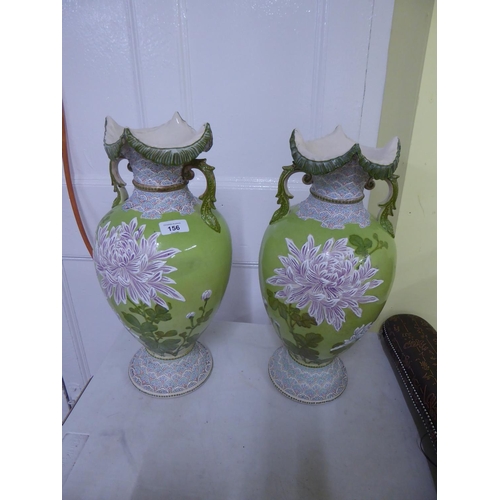 156 - A pair of green glazed floral pottery vases