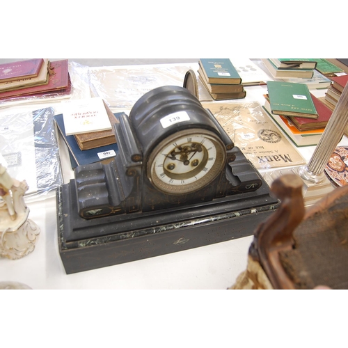 139 - 19thC arched top slate and marble mantel clock chiming on a bell