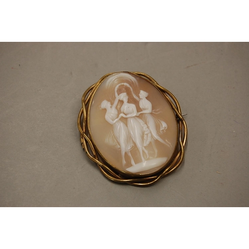 209 - A large cameo in gold coloured metal frame - The Three Graces