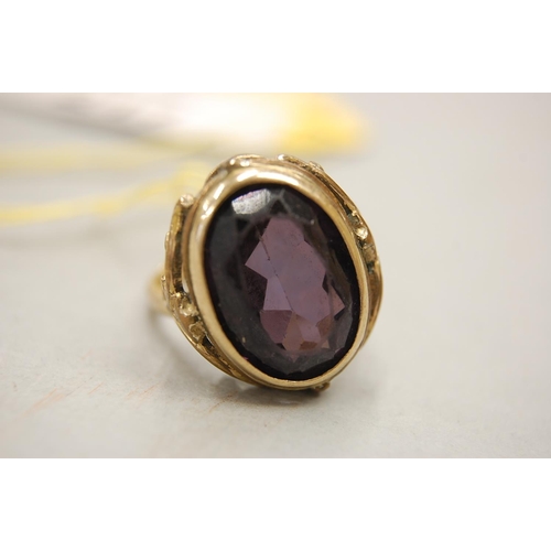 217 - A 9 ct. gold oval amethyst ring size M