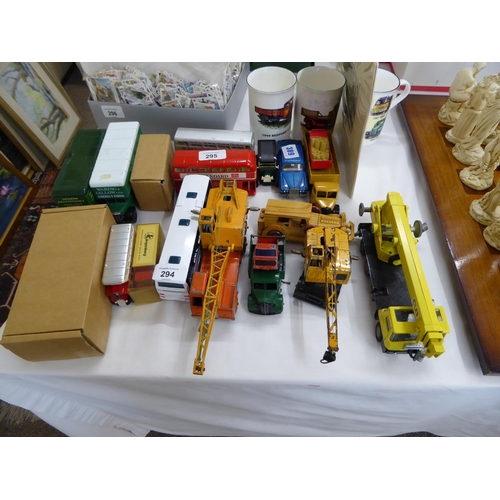 294 - A collection of Dinky super toys, corgi buses and trucks and mugs etc