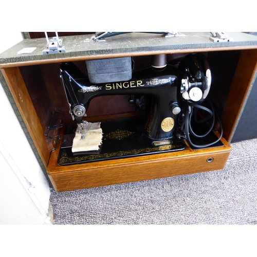 328 - A sewing machine, a typewriter and two brief cases