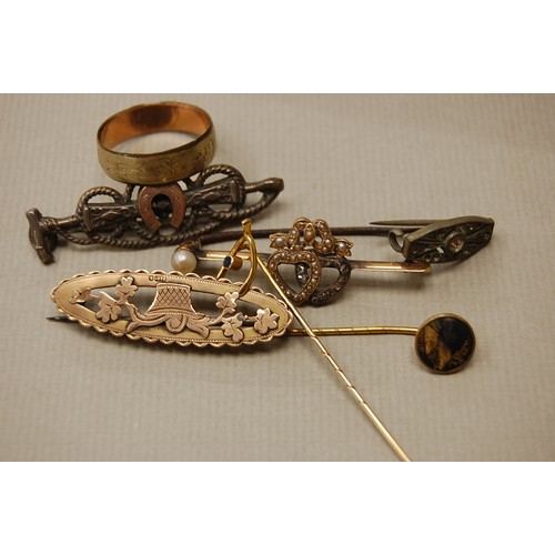 198 - A collection of gold brooches, stick pins etc.