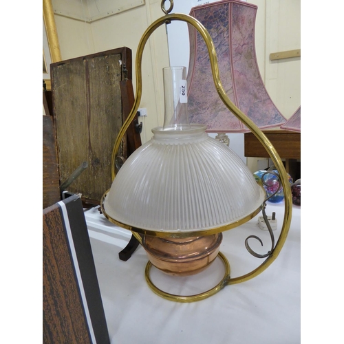 250 - A brass and copper hanging oil lamp