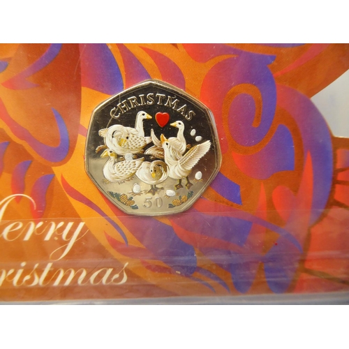 296 - A 2010 Isle of Man coloured Christmas 50p piece - six Geese a' Laying