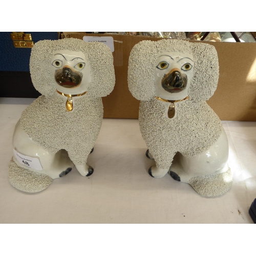 48 - Pair of pottery poodles