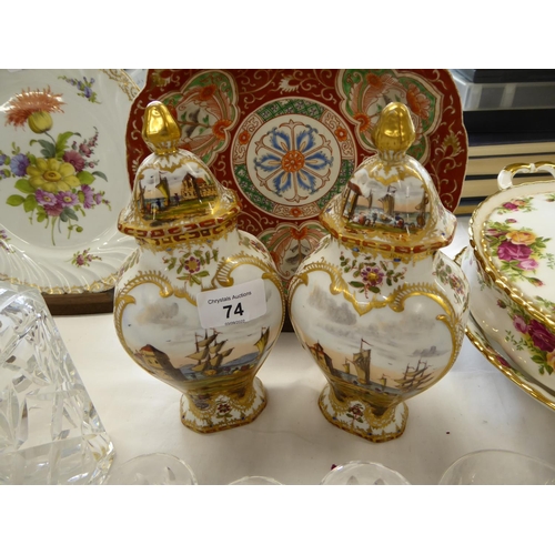 74 - Pair of continental porcelain urns with covers