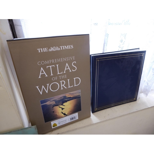 97 - Comprehensive atlas of the world plus an album of aircraft postcards