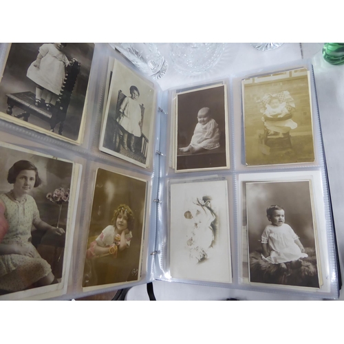 119 - Two albums of real photographic post cards mostly portraits