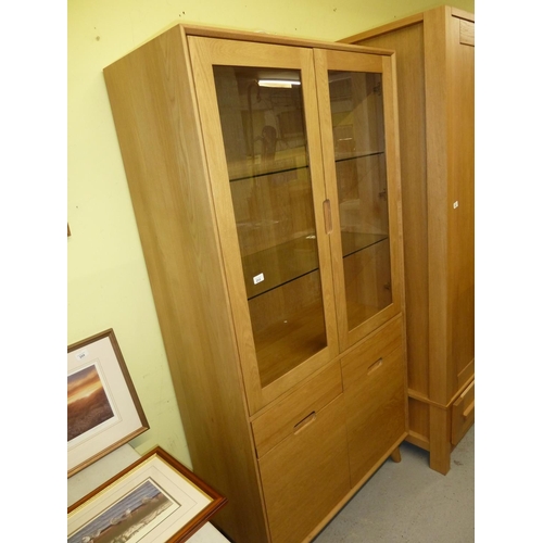 213 - Modern quality light oak cabinet/bookcase with drawers and cupboards under - height 72ins approx wid... 