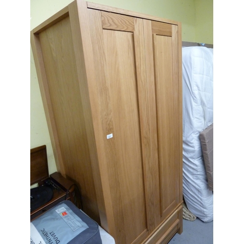 223 - Modern light oak wardrobe with single drawer - some slight damage