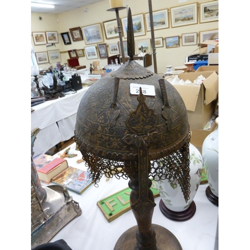 288 - Persian etched metal helmet with chain mail to back on a wooden stand