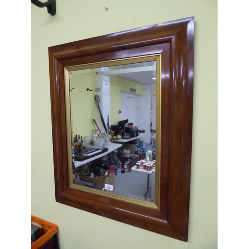 93 - Quality bevelled edge wall mirror in rosewood frame