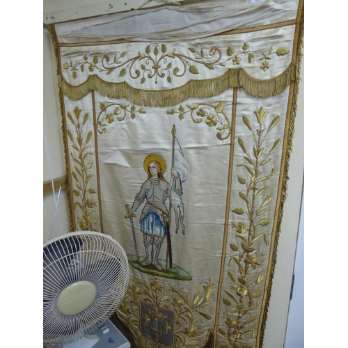 358 - A 19thC French silk and gold thread church banner with flora and fauna to borders, St. Joan of Arc t... 