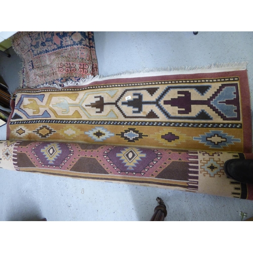 268 - Two wool rugs with geometric designs