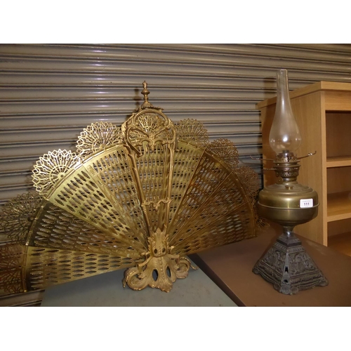 111 - Brass fancy fire screen, plus a brass oil lamp