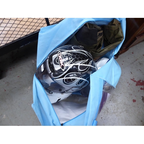 149 - Bag of motor cycle helmets and overalls