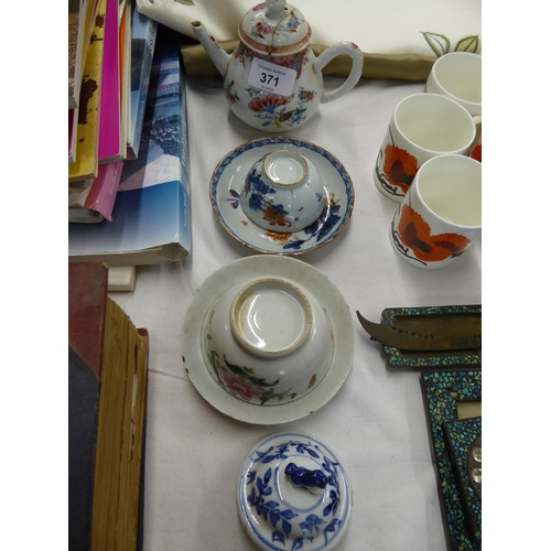 371 - A small collection of Chinese porcelain tea cups, saucers and a tea pot