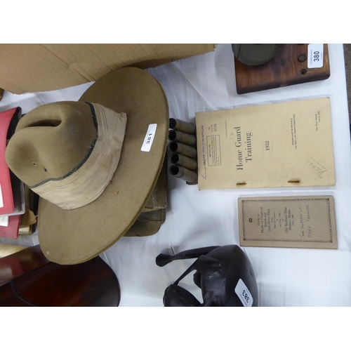 381 - A WWII Gurkha hat, K40 brass shell cases and other military items