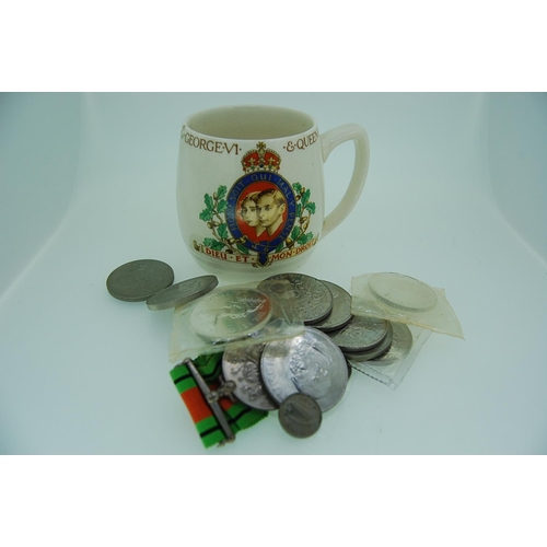 299 - A collection of crowns, medal, mug