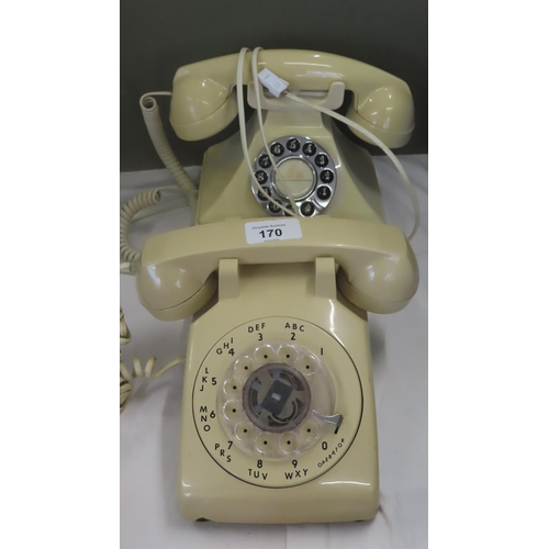 170 - Two old telephones together with coloured glass ashtrays