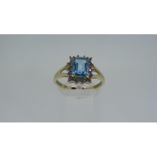 213 - A 9 ct. gold blue tourmaline - size P