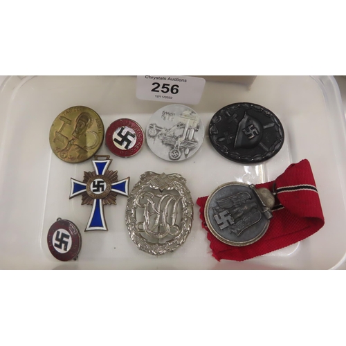 256 - A small collection of German medals and badges