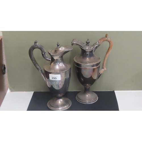 295 - Two silver plated claret jugs with fruitwood handles